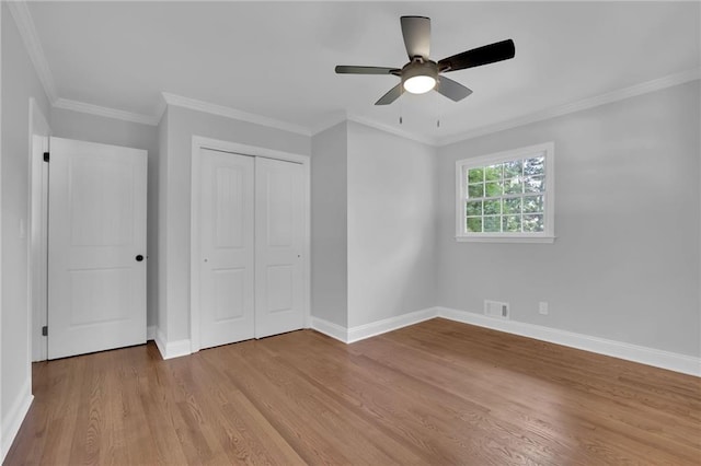 4669 Dunover Cir, Atlanta, GA 30360 - unfurnished bedroom with light wood-style flooring, a closet, ornamental molding, and ceiling fan