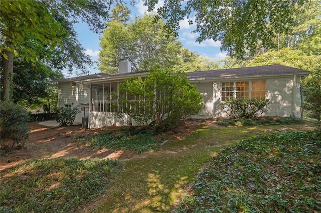 4669 Dunover Cir, Atlanta, GA 30360 - view of front of property with a chimney, a sunroom, and brick siding