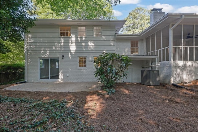 4669 Dunover Cir, Atlanta, GA 30360 - back of house featuring brick siding, a chimney, a patio, and a sunroom