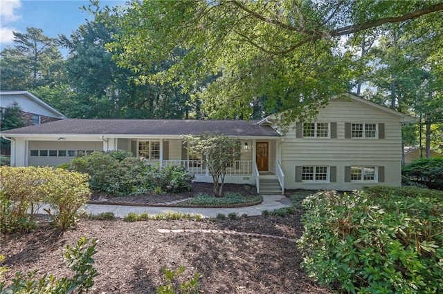 4669 Dunover Cir, Atlanta, GA 30360 - split level home featuring a porch and an attached garage