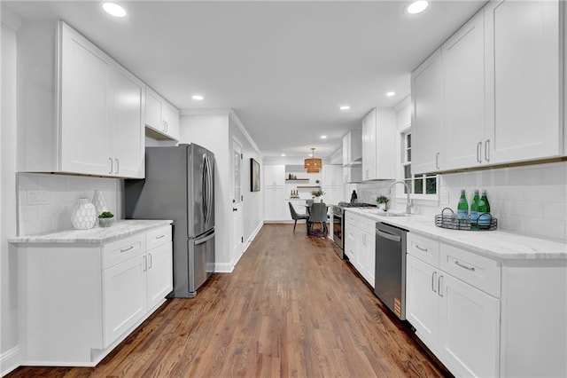 4669 Dunover Cir, Atlanta, GA 30360 - kitchen featuring stainless steel appliances, recessed lighting, dark wood-style floors, white cabinets, and decorative backsplash