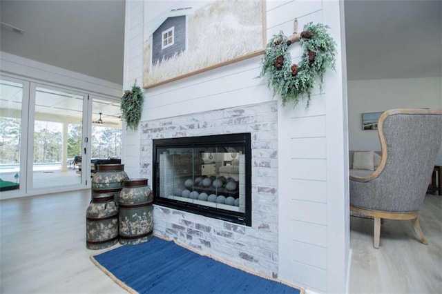 living room featuring a fireplace and wood finished floors