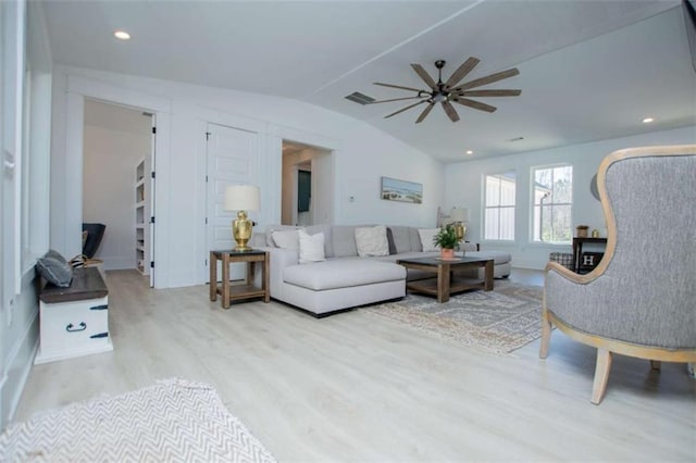 living room with visible vents, a ceiling fan, lofted ceiling, wood finished floors, and recessed lighting