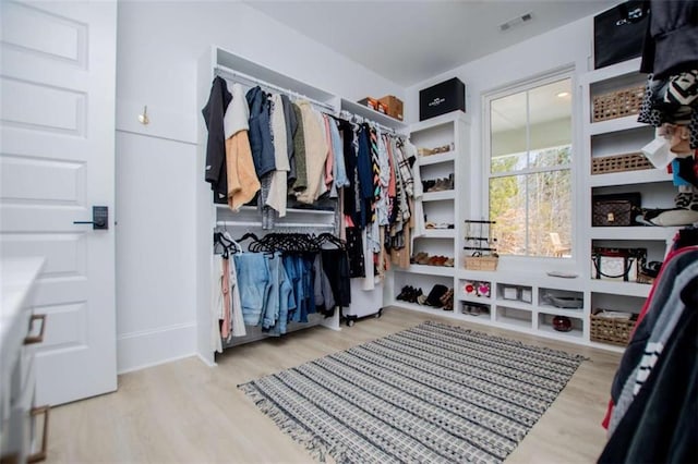 spacious closet with visible vents and wood finished floors