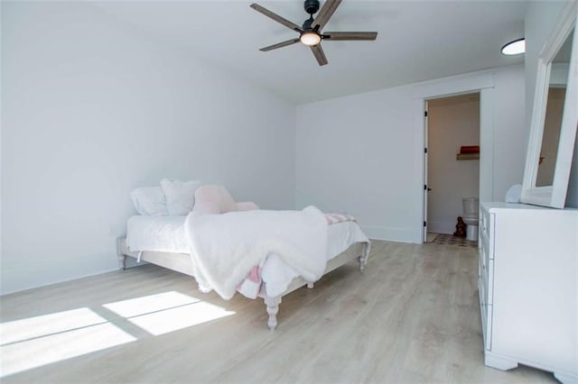 unfurnished bedroom featuring light wood-type flooring, baseboards, a ceiling fan, and independent washer and dryer