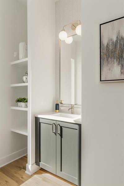 bathroom featuring vanity and wood-type flooring