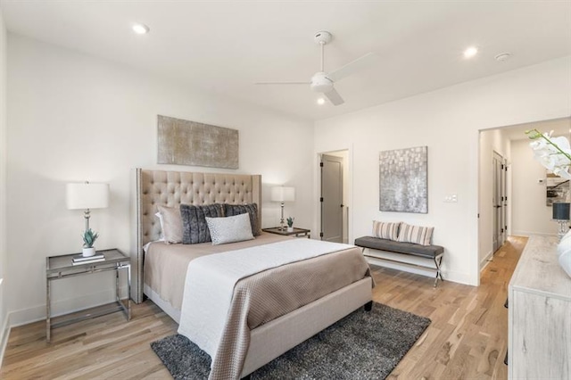 bedroom with ceiling fan and light hardwood / wood-style floors