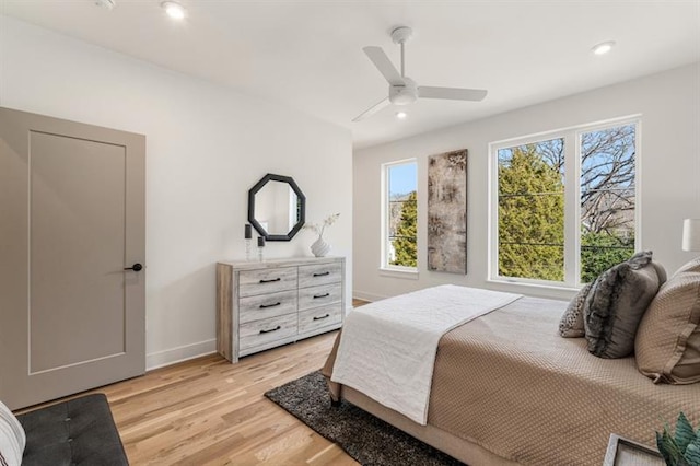 bedroom featuring ceiling fan and light hardwood / wood-style floors