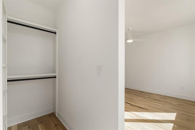 interior space with ceiling fan and hardwood / wood-style floors