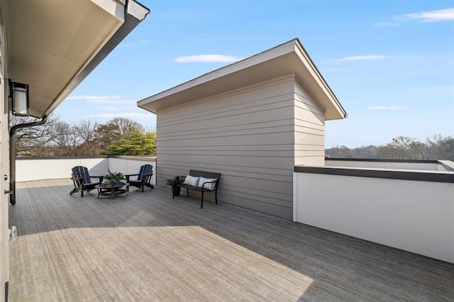 wooden deck featuring a fire pit