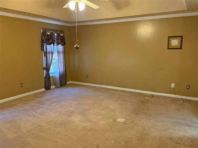 carpeted empty room featuring a textured ceiling, ceiling fan, and crown molding