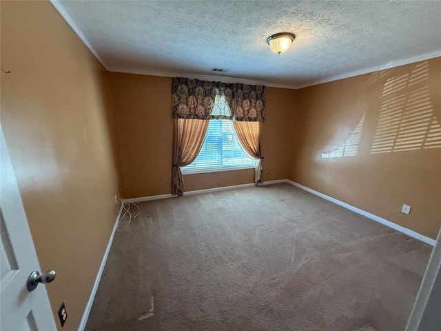 carpeted spare room featuring a textured ceiling and crown molding