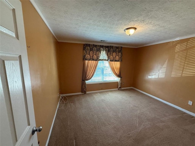 carpeted spare room with crown molding and a textured ceiling