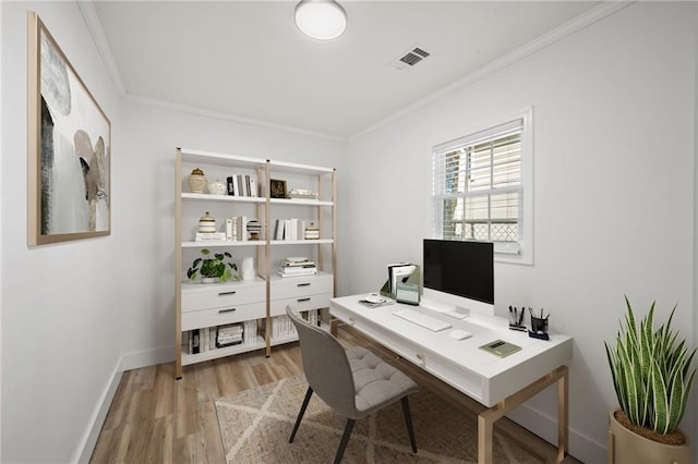 office area featuring ornamental molding, visible vents, baseboards, and wood finished floors