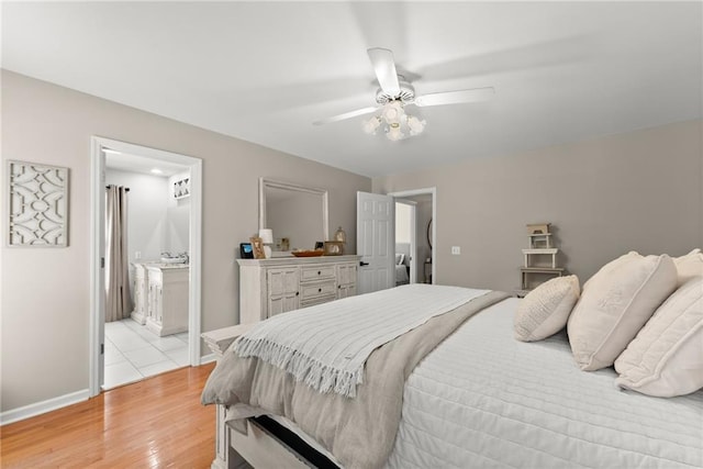 bedroom with baseboards, light wood-type flooring, and a ceiling fan