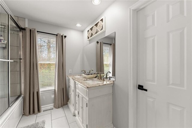 full bath featuring a sink, recessed lighting, tile patterned flooring, visible vents, and double vanity
