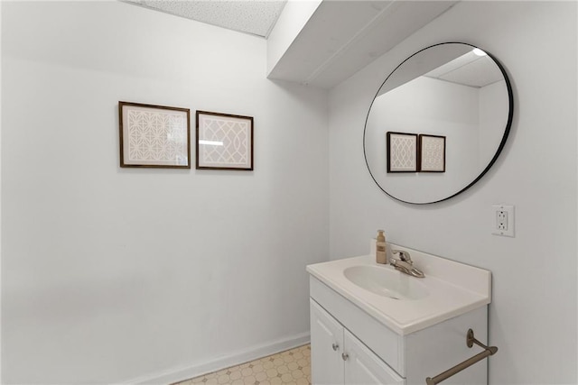 bathroom featuring baseboards, vanity, and tile patterned floors
