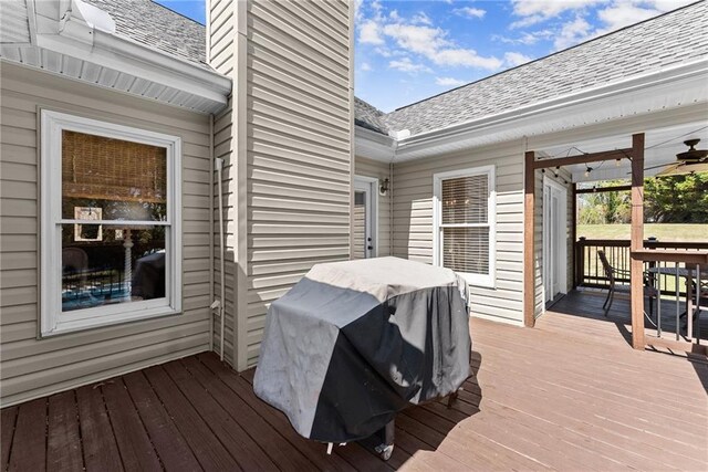wooden deck featuring area for grilling
