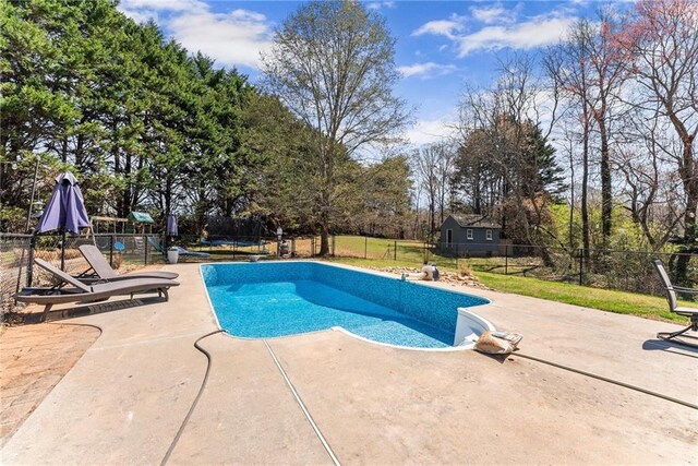 view of pool with a patio, a fenced in pool, and fence