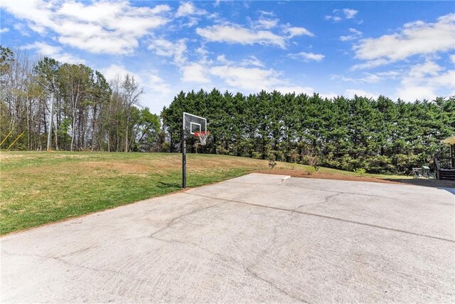 view of patio with basketball hoop