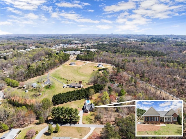 bird's eye view featuring a view of trees