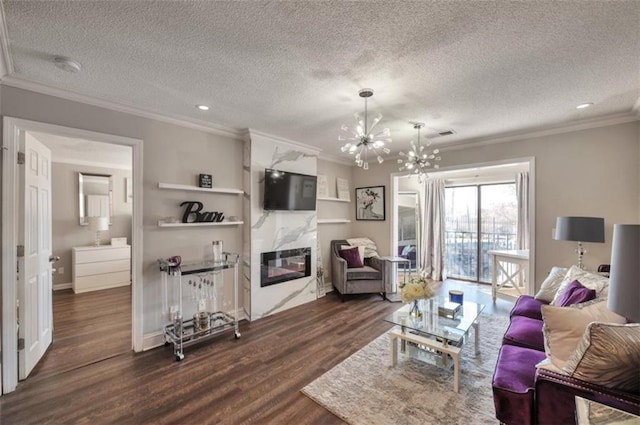 2657 Lenox Rd Unit C30, Atlanta, GA 30324 - living area with dark wood-style flooring, crown molding, a fireplace, an inviting chandelier, and a textured ceiling