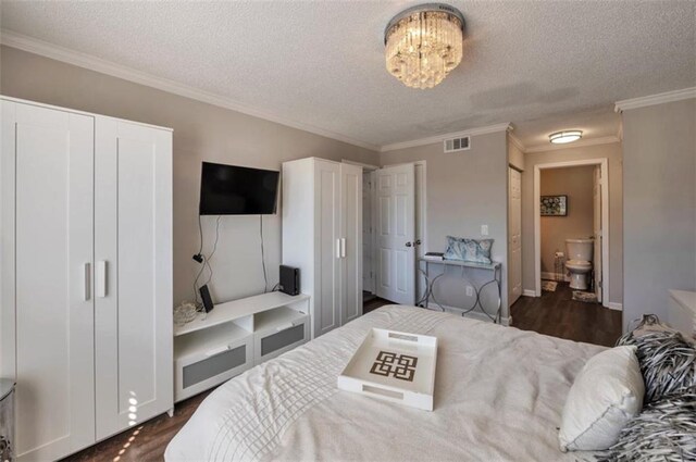 2657 Lenox Rd Unit C30, Atlanta, GA 30324 - bedroom with a textured ceiling, dark wood-style flooring, visible vents, and a notable chandelier