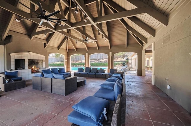 2657 Lenox Rd Unit C30, Atlanta, GA 30324 - view of patio / terrace with a ceiling fan, a gazebo, and an outdoor living space with a fireplace