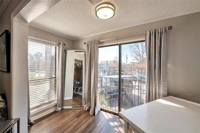 2657 Lenox Rd Unit C30, Atlanta, GA 30324 - doorway with a textured ceiling and wood finished floors