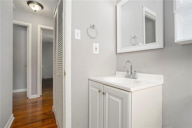 bathroom with wood-type flooring and vanity