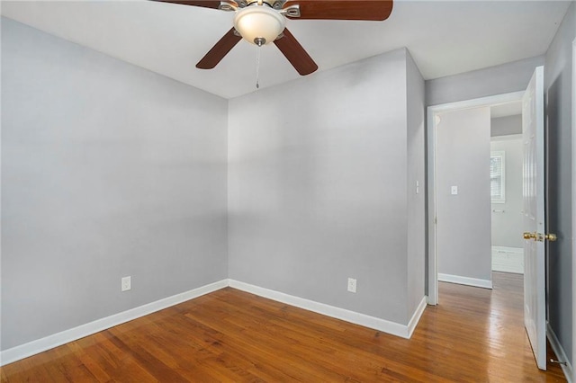 spare room with ceiling fan and hardwood / wood-style floors