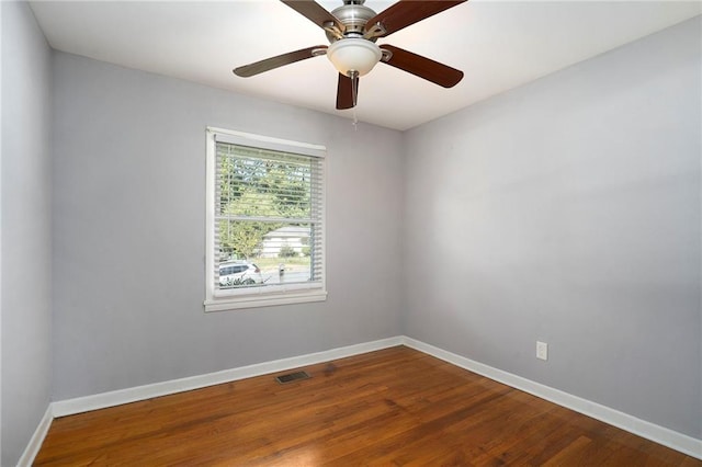 empty room featuring ceiling fan and wood-type flooring