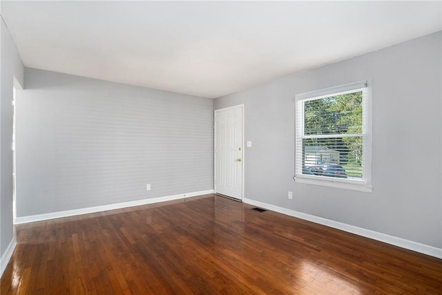 empty room featuring wood-type flooring