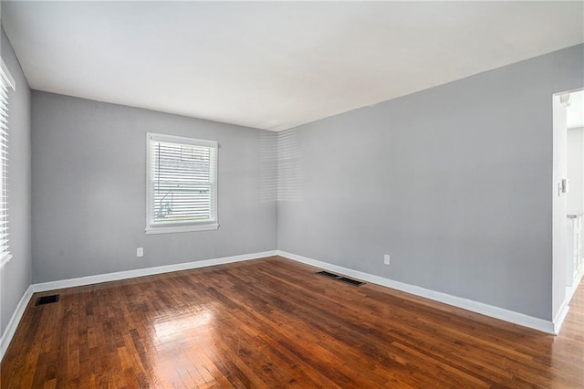 spare room featuring hardwood / wood-style floors