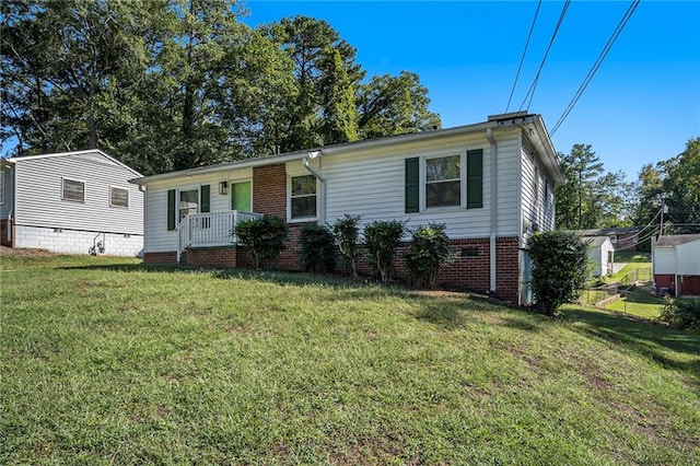 view of front of house with a porch and a front yard