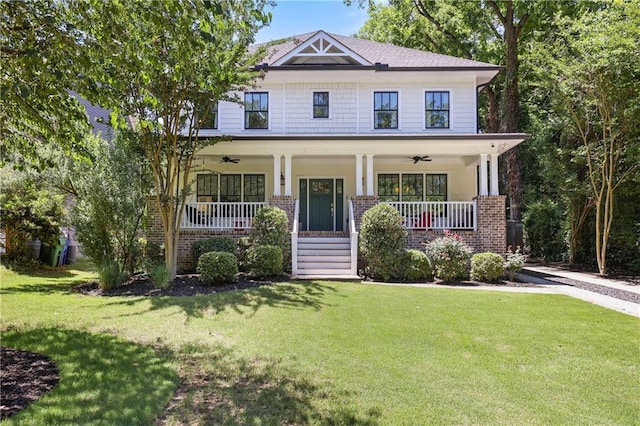 1297 Conway Rd, Decatur, GA 30030 - view of front of property with a ceiling fan, brick siding, and a front yard