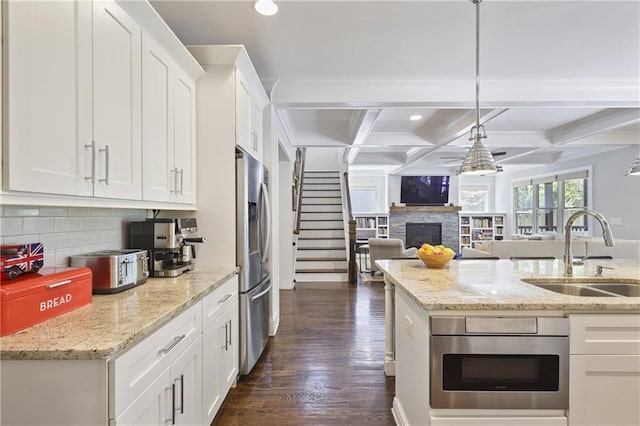 1297 Conway Rd, Decatur, GA 30030 - kitchen with a sink, stainless steel fridge with ice dispenser, a fireplace, tasteful backsplash, and recessed lighting