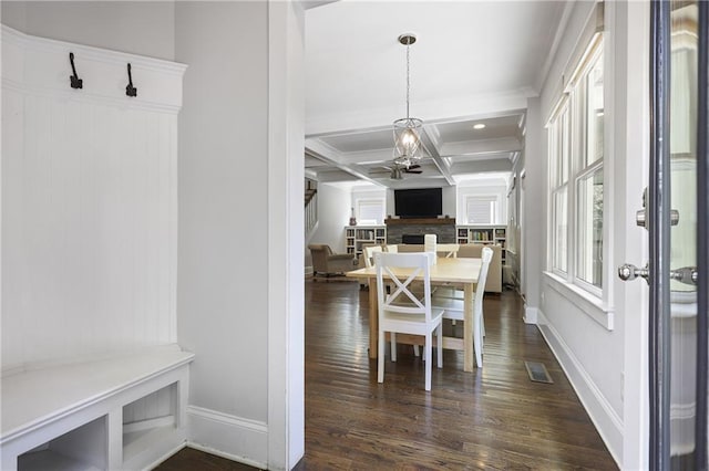 1297 Conway Rd, Decatur, GA 30030 - dining space featuring coffered ceiling, dark wood finished floors, baseboards, beam ceiling, and a fireplace