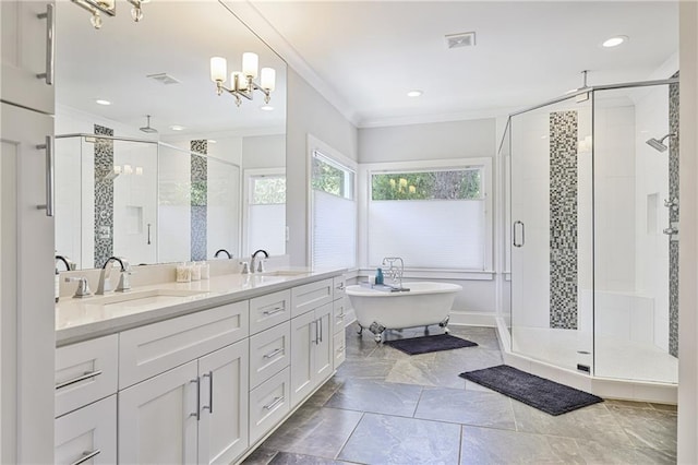 1297 Conway Rd, Decatur, GA 30030 - bathroom featuring a stall shower, crown molding, a freestanding bath, double vanity, and a chandelier