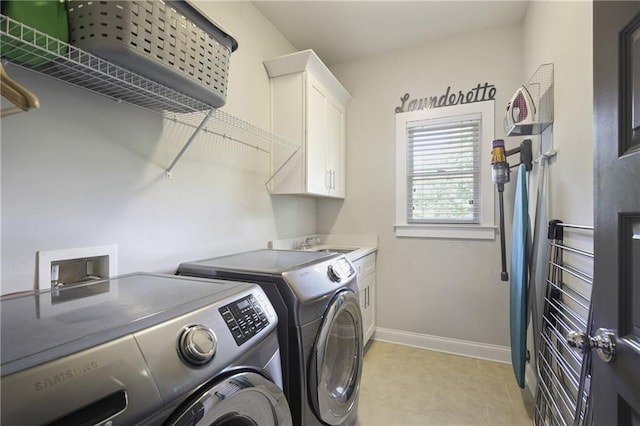 1297 Conway Rd, Decatur, GA 30030 - washroom featuring independent washer and dryer, cabinet space, baseboards, and light tile patterned floors