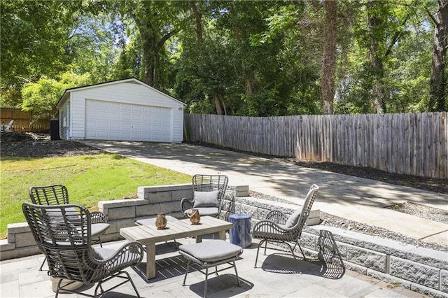 1297 Conway Rd, Decatur, GA 30030 - view of patio with a detached garage, an outdoor structure, and view of scattered trees