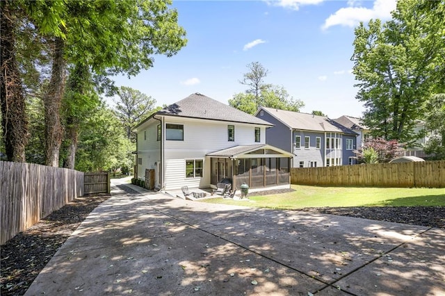 1297 Conway Rd, Decatur, GA 30030 - back of house with a sunroom and a patio