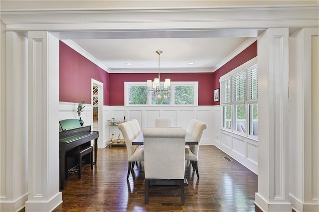 1297 Conway Rd, Decatur, GA 30030 - dining room featuring a decorative wall, a chandelier, dark wood-type flooring, wainscoting, and ornamental molding