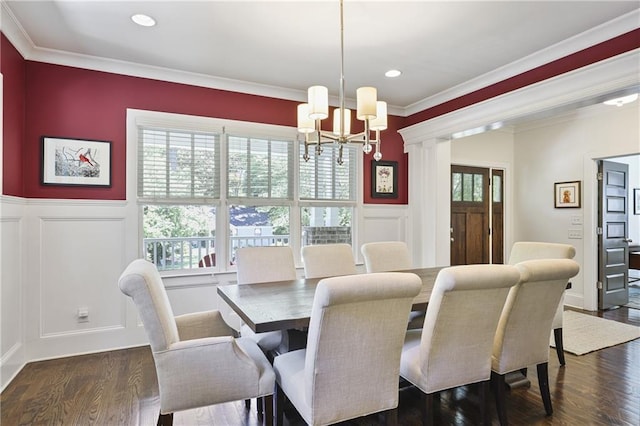 1297 Conway Rd, Decatur, GA 30030 - dining room featuring a chandelier, a decorative wall, a wainscoted wall, crown molding, and dark wood-style floors