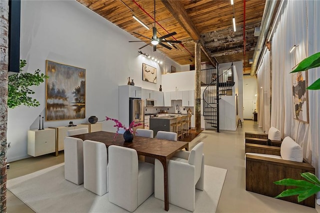 170 Boulevard Se 115E, Atlanta, GA 30312 - dining room featuring wooden ceiling, finished concrete flooring, stairs, a towering ceiling, and a ceiling fan