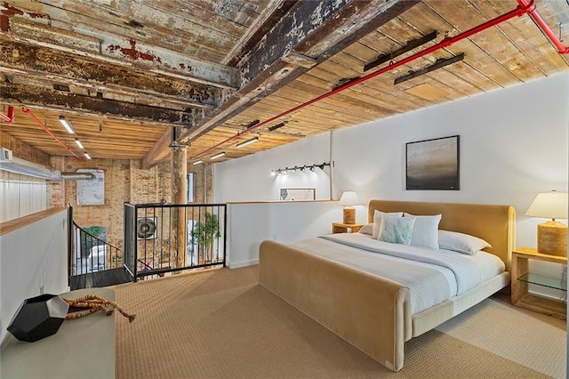 170 Boulevard Se 115E, Atlanta, GA 30312 - bedroom featuring carpet floors, rail lighting, baseboards, and wooden ceiling