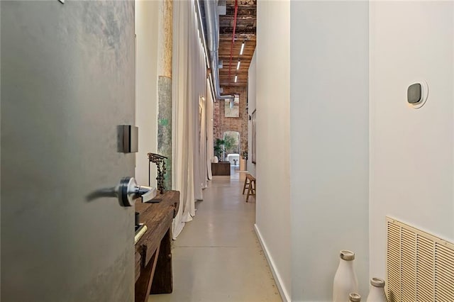 170 Boulevard Se 115E, Atlanta, GA 30312 - hallway featuring finished concrete flooring, a towering ceiling, and baseboards