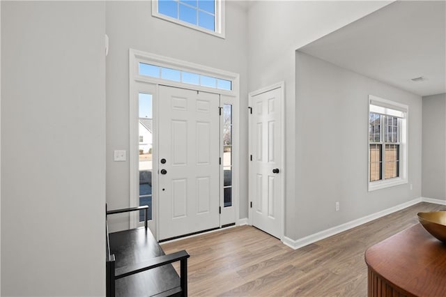 entrance foyer with light hardwood / wood-style floors