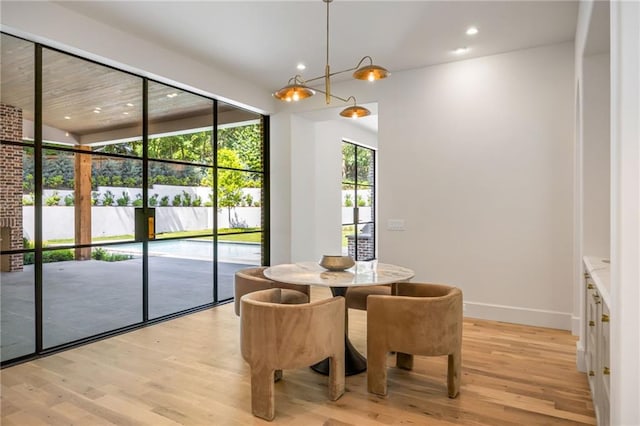 2515 Habersham Rd, Atlanta, GA 30305 - dining space featuring light wood finished floors, recessed lighting, a chandelier, and baseboards