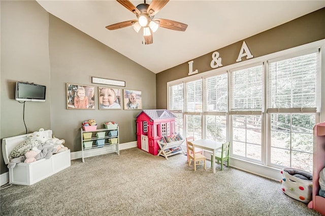 playroom with light carpet, lofted ceiling, and ceiling fan